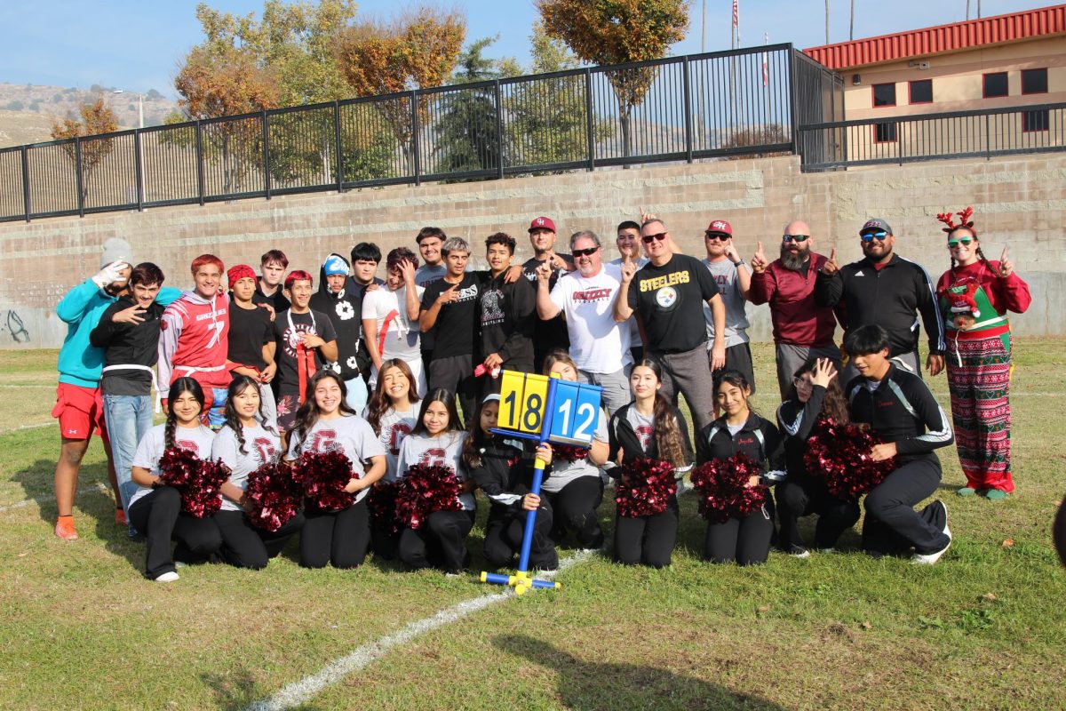 Staff, players and cheerleaders pose for a picture following the Granite Hills Turkey Bowl. 