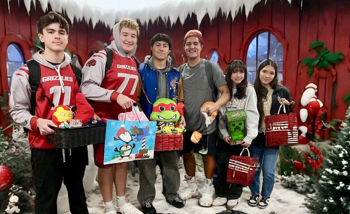 Granite Hills High School students pose with their gift exchange presents in this photo with an AI-generated background.