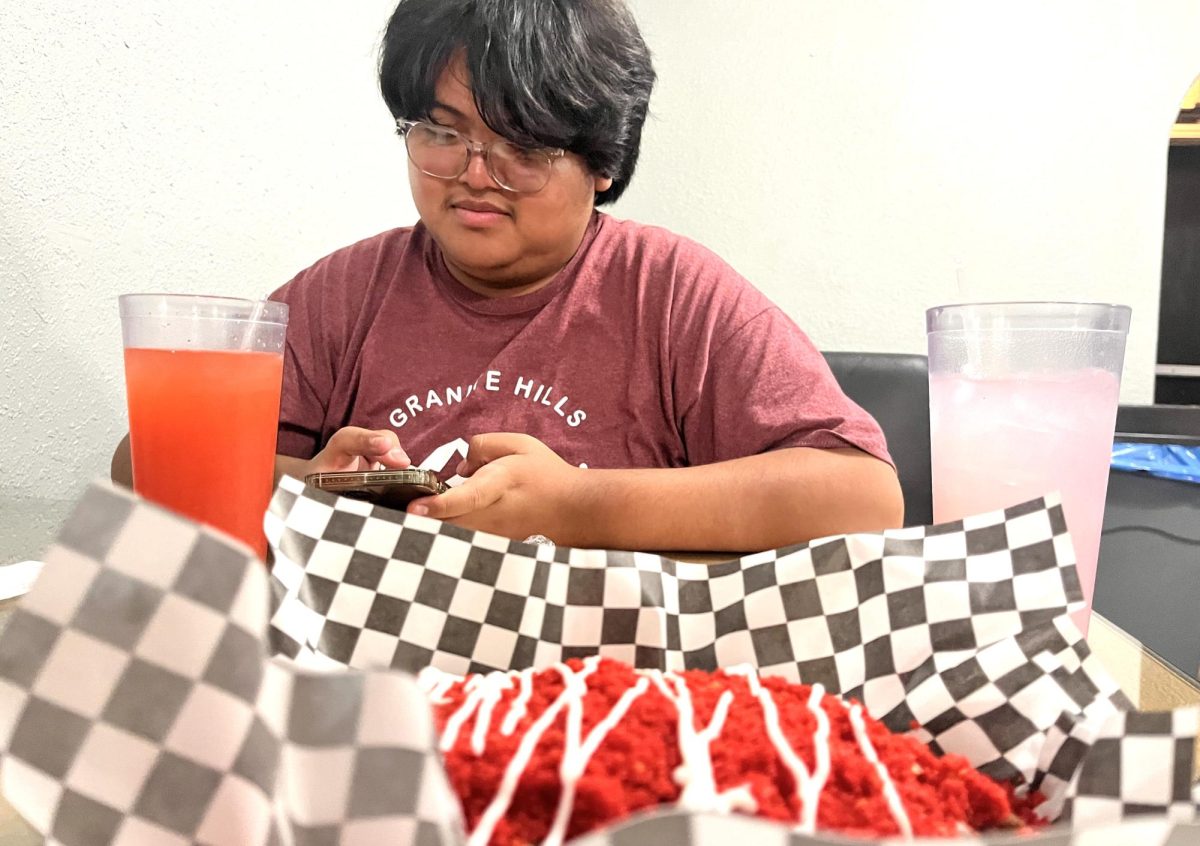 Granite Hills senior Jose Nava prepares to enjoy his meal at Papas The Loaded Baked Potato Company