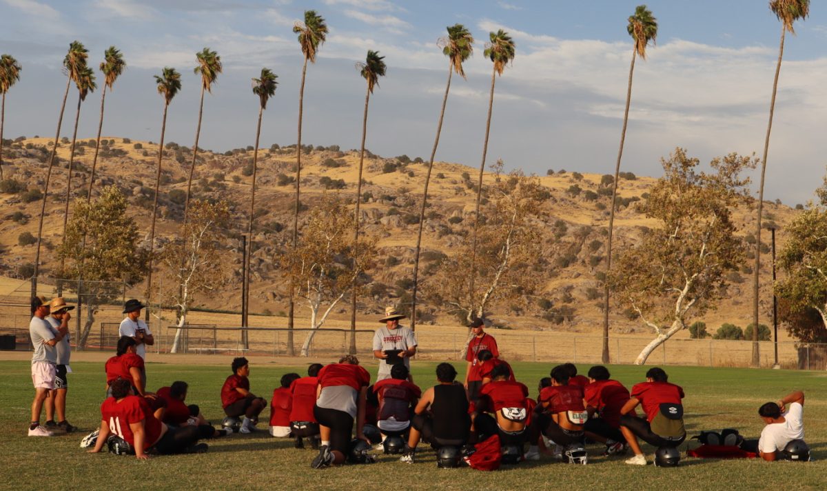 Granite Hills coach Carl Scudder talks to his team after practice on Aug. 25.