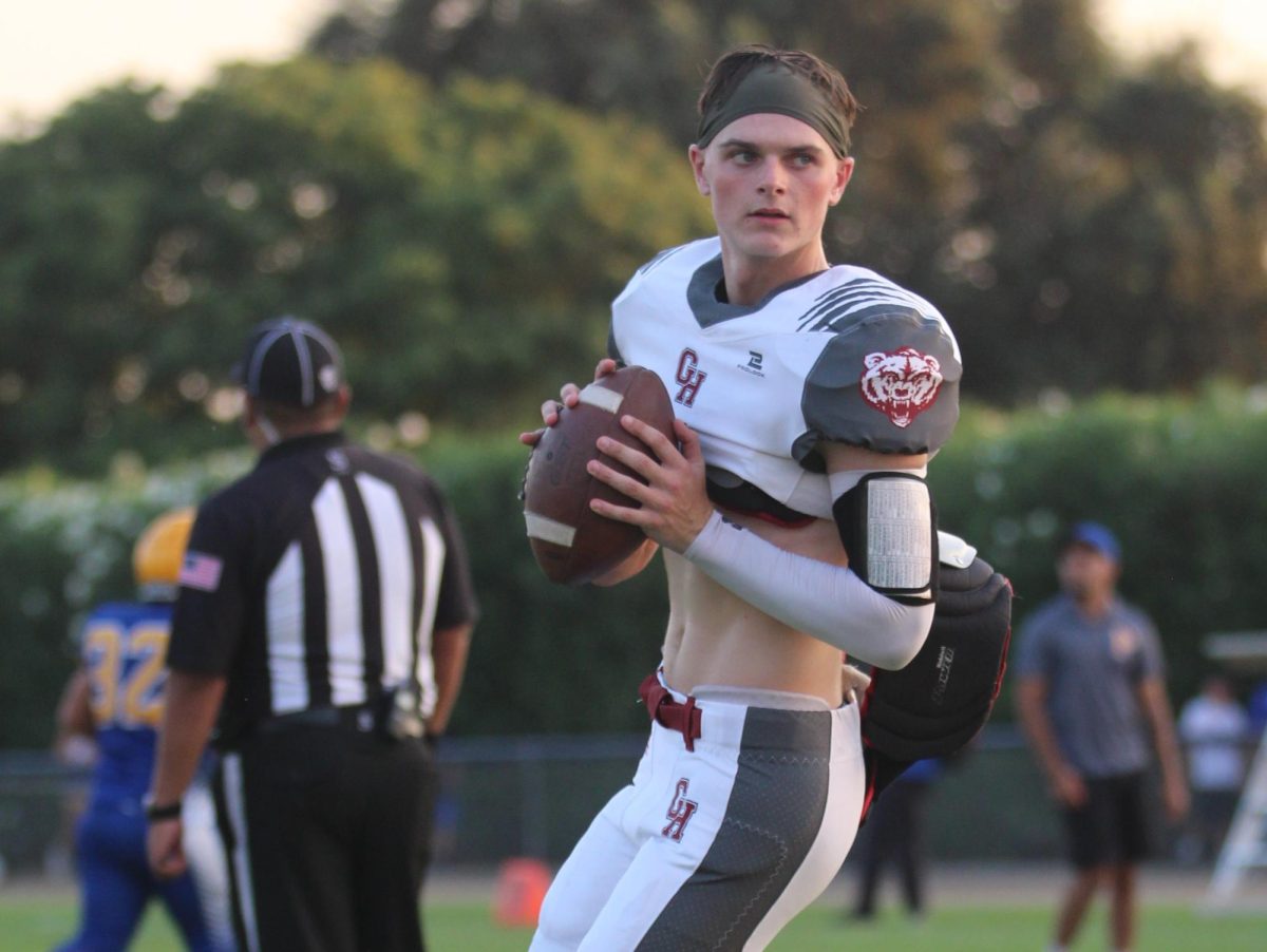 Granite Hills quarterback Rhyan Vinson warms up for a football game. 