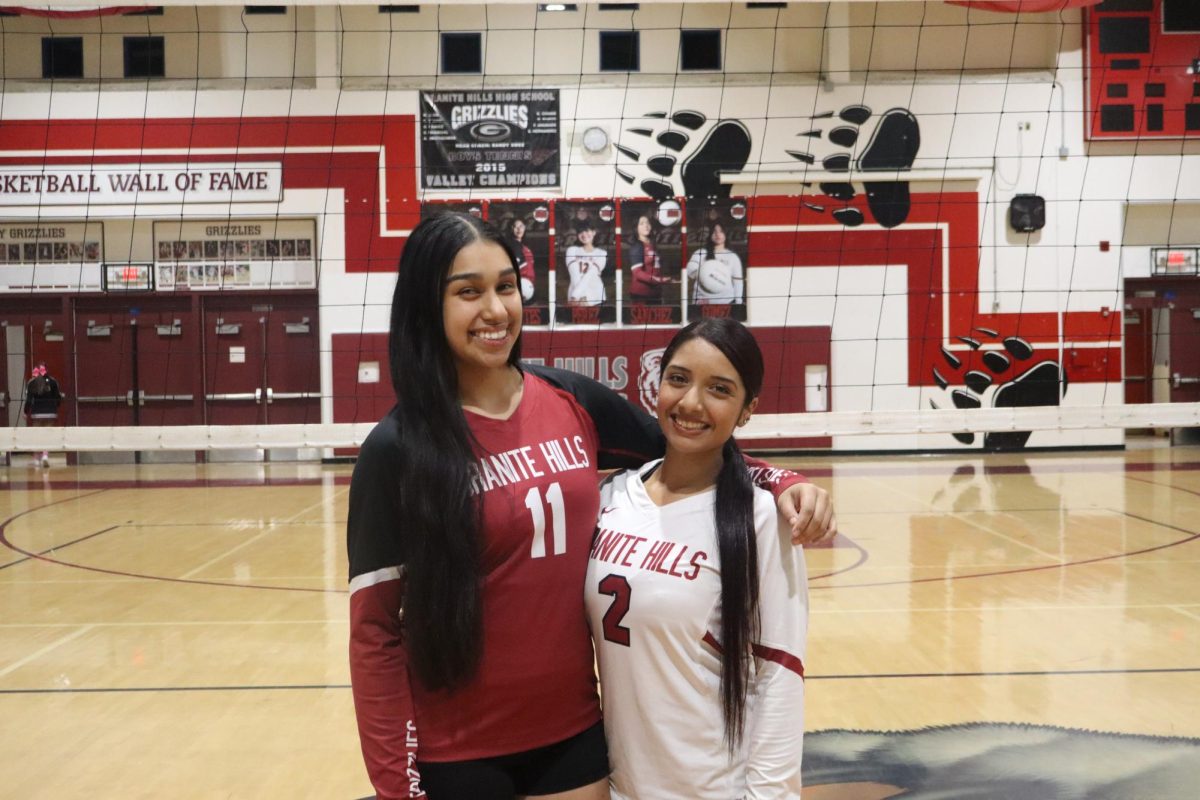 Amberly Jaramillo and Josaleen Garay after their last volleyball match on senior night.