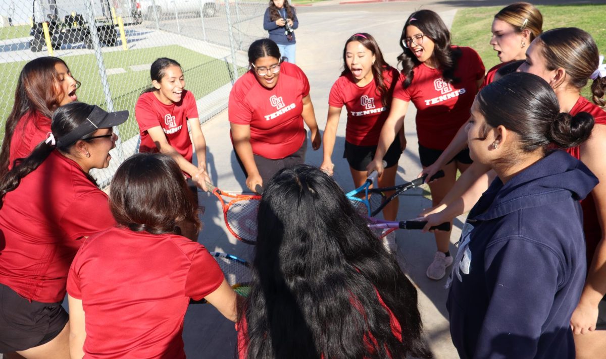 The girls tennis team breaks before their match against Orange Cove on senior night on Oct. 9. 