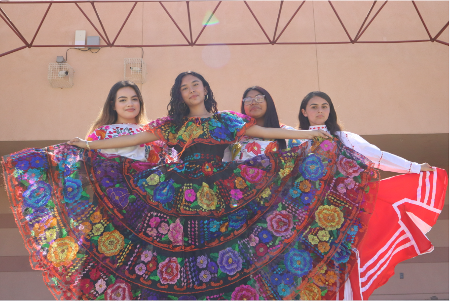 Granite Hills students who are members of the Ozomatli Folklorico dance team pose for a picture. 
